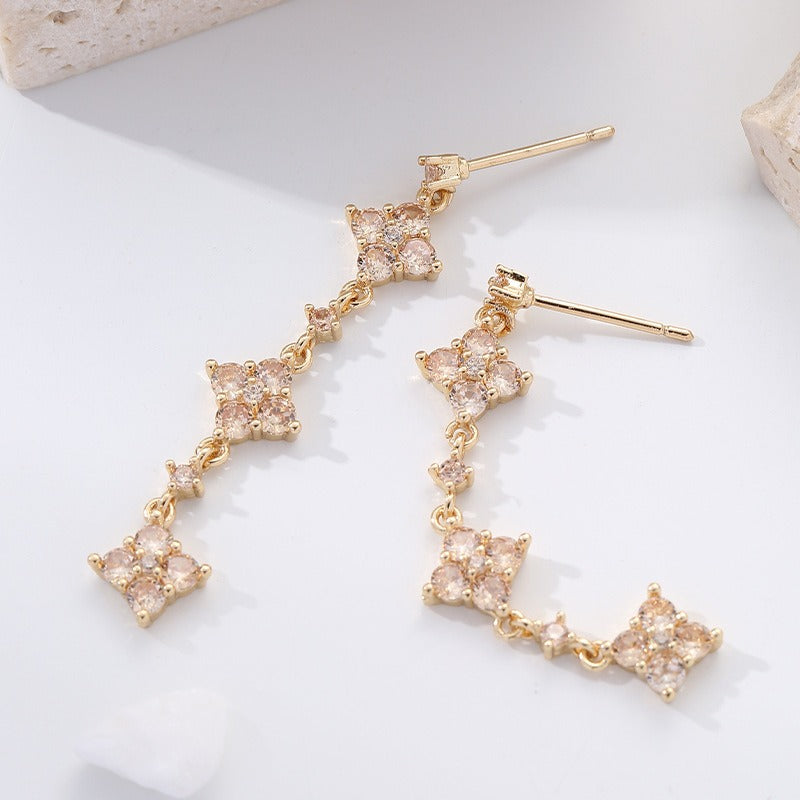 Copper plated zirconium plated four leaf grass long tassel earrings