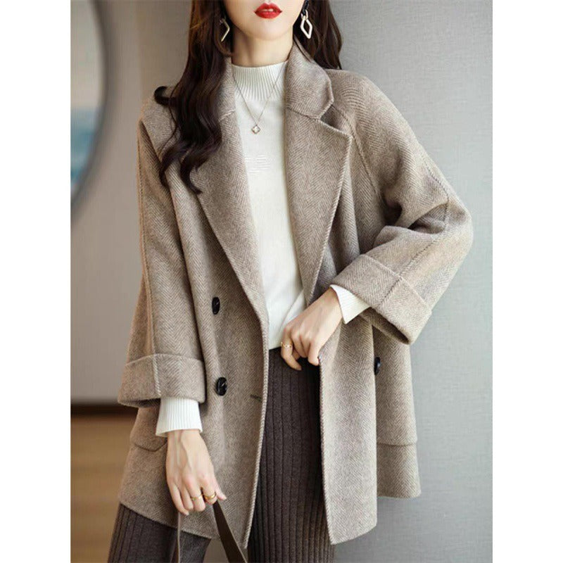 New herringbone patterned woolen coat with loose fit and slimming effect