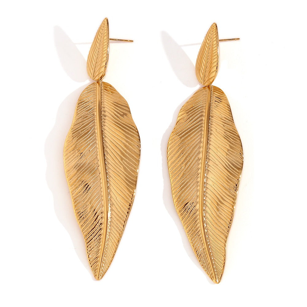 Gold spliced feather leaf earrings of different sizes