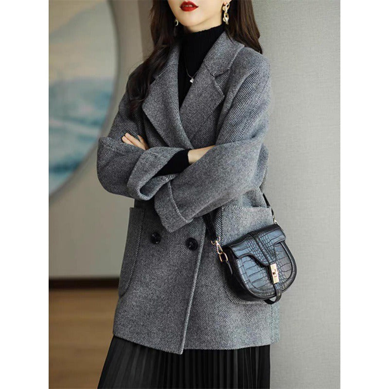 New herringbone patterned woolen coat with loose fit and slimming effect