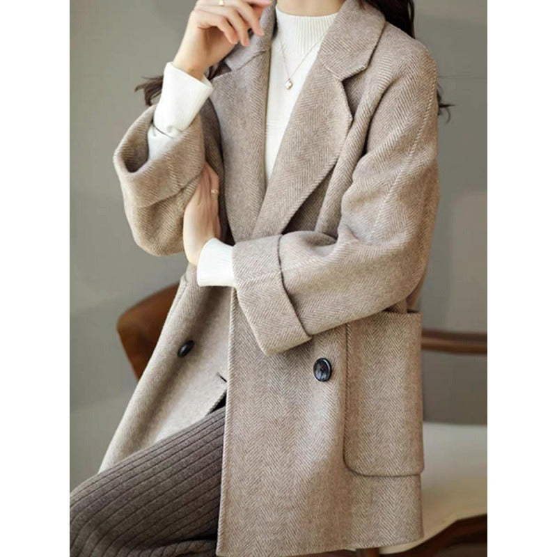 New herringbone patterned woolen coat with loose fit and slimming effect